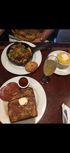 Scramble with biscuits and grits; french toast with Canadian bacon and apple mimosa from the brunch menu! at Ethos Vegan Kitchen in Winter Park