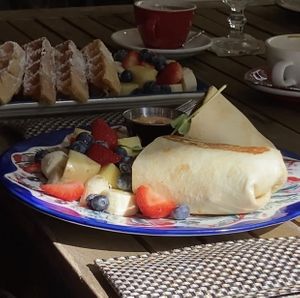 Breakfast burrito and waffles in the back  at Number 10 in Willemstad