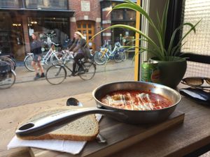 Shakshuka - 2 eggs in tomato sauce - super yummy - 9/10 stars  at FLFL in Groningen