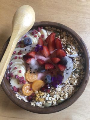 Banana and berry smoothie bowl with granola and so many delicious fruits!  at Zatua Miski in Cuenca