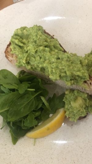 Avocado on toast (half eaten) without black pepper and chilli for our 6 year old   at 269 Vegan in Perth