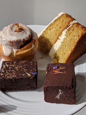 Cinnamon bun, lavender brownie, raspberry brownie and elderflower sponge at 269 Vegan in Perth