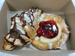 Chocolate filled croissant and cherry Danish at Vegan Danish Bakery in Toronto