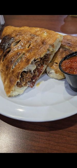 "sausage pepperoni" calzone with tofu feta. seriously the best calzone I've ever had!!! at Bodacious Bakehouse in Virginia Beach