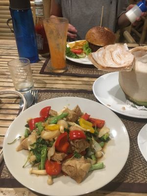Stir fried basil and veggie burger in the back ground at Taste From Heaven in Koh Phangan