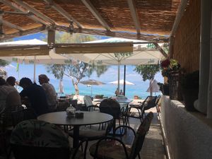 The restaurant is located right next to the ocean. at Copa Cabana in Patmos