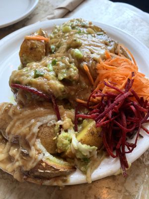 Sesame Fries with guacamole and gravy  at The Naam in Vancouver