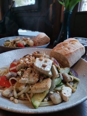 vegan pasta with grilled veggies (zucchini, paprika, celery, onion, mushrooms) and added marinated tofu. The dish came with warm bread and pine seeds and all together it was very t at Cafe au Lait in Berlin