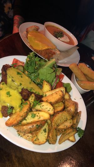 Seitan steak, mozerella sticks, red lentil soup with melted cheese  at Veganaes in Reykjavik