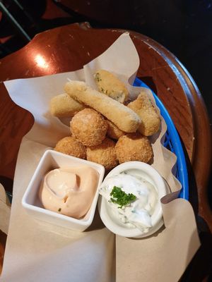 Mixture of cheese balls and cheese sticks because they didnt have enough sticks 😭 so kind!! (790kr) at Veganaes in Reykjavik