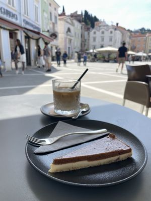 Raw vegan plum cake & soya milk ice latte   at Mestna Kavarna in Piran