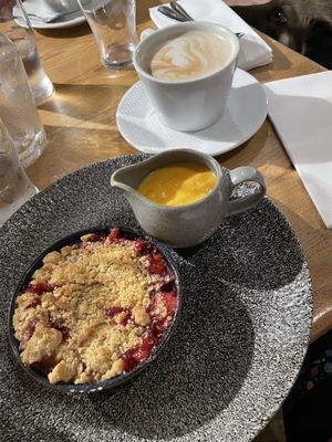 DELICIOUS apple and blackberry crumble with custard (mini size shown) with oat lattee  at The Bosham Inn in Chichester