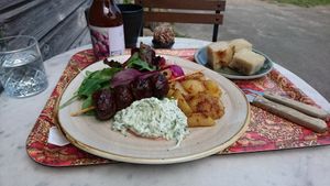 Great vegan lunch option "Souvlaki" with lemonbaked potatoes, tzatziki and sallad. Coffee and ball of chocolate nuts in background. at Byvägen35 in Sankt Olof