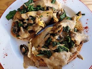 Mixed oyster mushroom bring with spinach and tarragon cream on sourdough toast at Hullabaloo in Ipswich