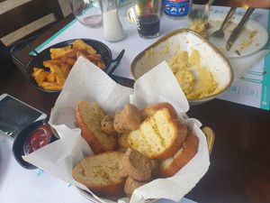 Double-fried fries, garlic bread, fava dip. Vegan yummy at Portego in Crete