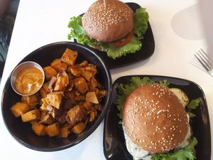 2 burgers with a side of sweet potato bites at Copper Branch in Kingston