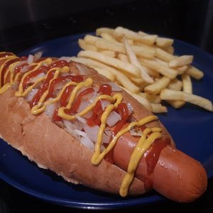 The 10inch Pek Dog! A meaty textured Frankfurter style hot dog. Made entirely from plants! Soya free! 
Topped with fried onions ketchup and mustard. Served with fries.  at PEK in Dover