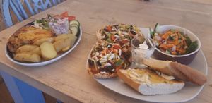 Pek pitta pizza with home made may garlic bread and salad.  And Homemade Quiche salad and new potatoes. Home made red cabbage coleslaw too.  at PEK in Dover