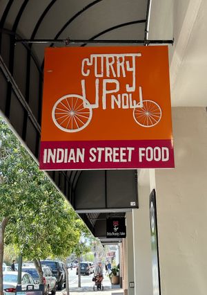 Sidewalk sign   at Curry Up Now - Hamilton Ave in Palo Alto