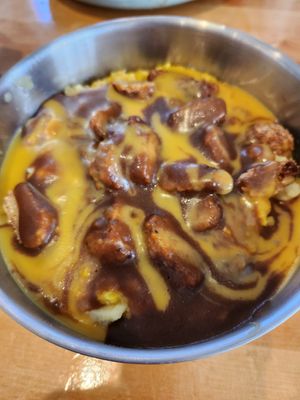 Almost famous bowl smothered in cheese and gravy! To die for. at The Wayside Cafe & Deli in Olympia