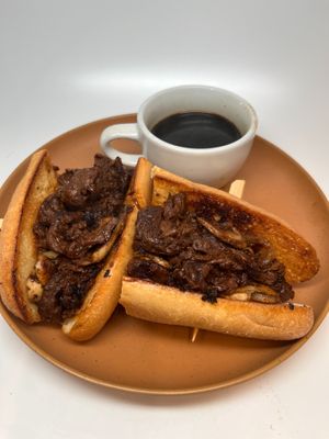 The Dip: Stake style soy curls sauteed with mushrooms and onions, piled on a fresh toasted hoagie. Served with house au jus and choice of side.  at The Wayside Cafe & Deli in Olympia