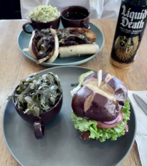 The Norma classic fried chicken sandwich with side of collard greens and The Dip steak style sandwich with Sesame slaw.  Absolutely delicious!  at The Wayside Cafe & Deli in Olympia