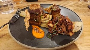 Porq Belly: Juniper and bay braised porq seitan, carrot and star anise puree, umami glaze, sous vide charred fennel, spiced apple and cabbage bhaji, five spice crackling. at Offbeet - New Forest in Southampton