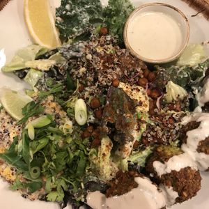 Kale Caesar salad with falafel and creamed spicy creamed sweet corn  at Honest Greens - Hortaleza in Madrid