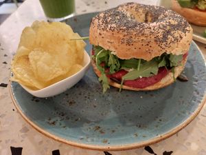 Vegan bagel with beetroot hummus and vegan feta cheese at Socola in Murcia
