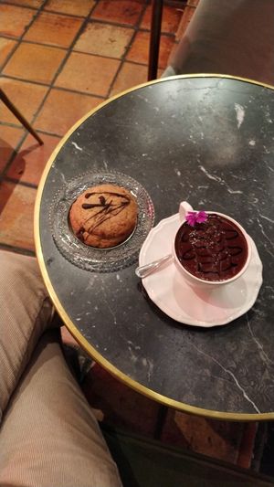 Hot chocolate with a vegan butter cookie at Bombon in Madrid