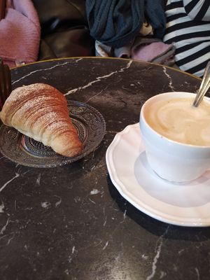 Normal croissant and latte. at Bombon in Madrid