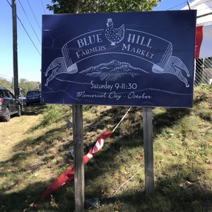 Fairgrounds location sign at Blue Hill Farmer's Market in Blue Hill