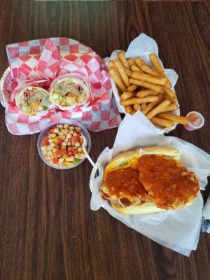 Wrap, yucca fries, chick pea salad, chick on parm. at Thank Goodness It's Vegan in Goshen
