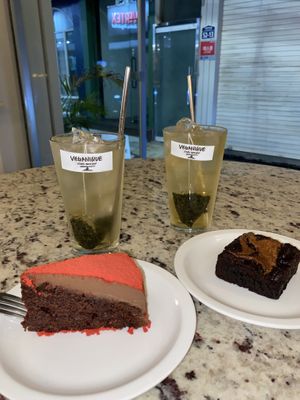 Peanut butter brownie and strawberry red velvet cakes (and iced mint tea)  at Veganique in Seoul