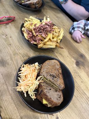 Chicken and pesto toastie with a side of cheese and bacon loaded fries   at Megafauna in Southport