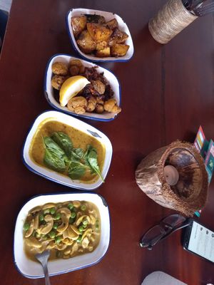 Potatoes, mushrooms  deal, peas with cashews - vegan and gluten-free, all very tasty but cery very very hot, unfortunately we couldn't finish our meal. The portions are small. at The Coconut Tree in Oxford