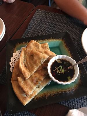 Deliciously crispy and flavorful scallion pancakes with ginger/soy sauce  at Thantawan Thai in Dracut