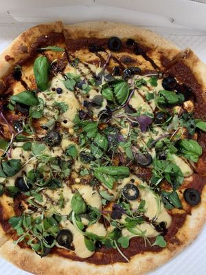 Vegan pizza in its takeout box at Nammi Plant Lab in Seoul