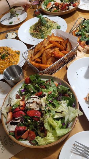 bunch of dishes shared among a group of people at Nammi Plant Lab in Seoul