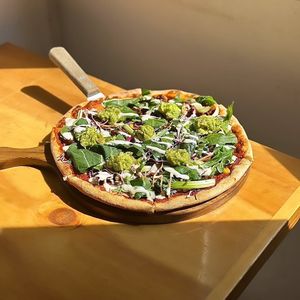 Birria Taco Pizza featuring guacamole, vegan birria beef, vegan sour cream &
lemon balm. at Nammi Plant Lab in Seoul