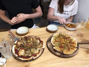 Regular pizza and hummus pizza - yum!  at Nammi Plant Lab in Seoul