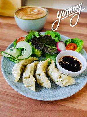 I had this amazing vegetable gyoza and a great cup of coffee. at Roots Cafe in Abergele