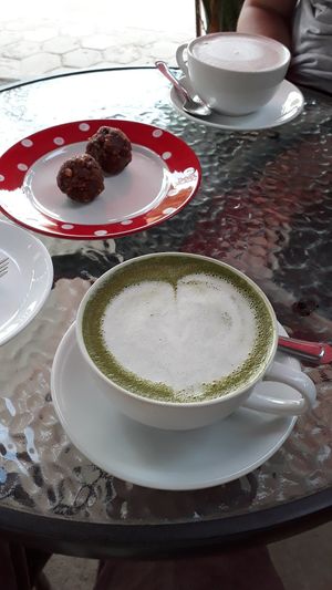 Matcha latte with soy milk, energy balls and hot chocolate with soy milk at Cafe Eh Eh in Vang Vieng