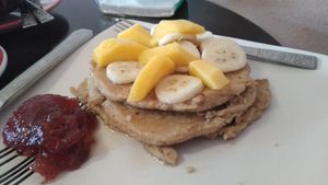 Vegan oat based pancake with Maple syrup on top at Cafe Eh Eh in Vang Vieng