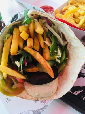 Vegan falafel wrap with homous, mixed salad and chips. Very hefty, €9 but very substantial and didn’t need any dinner after this for lunch! at Georgie's Handy Food in Ayia Napa
