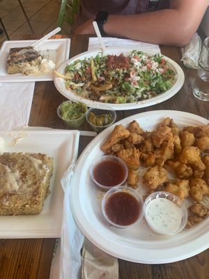 partial portions, everything is DELISHHHHHH walnut meat nacho fries & lemon pep wings  at Trio Plant-Based in Minneapolis