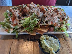 Nachos with a side of guac at Trio Plant-Based in Minneapolis