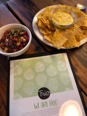 Delicious bean salad & chips and cheeze sauce   at Trio Plant-Based in Minneapolis