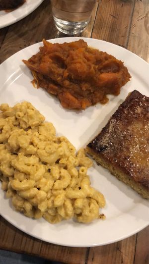 sweet potatoes, mac and cheese and corn bread at Trio Plant-Based in Minneapolis