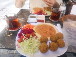 Mint tea, salad, falafel, houmous, ful and bread with dips at Falafel House in Istanbul